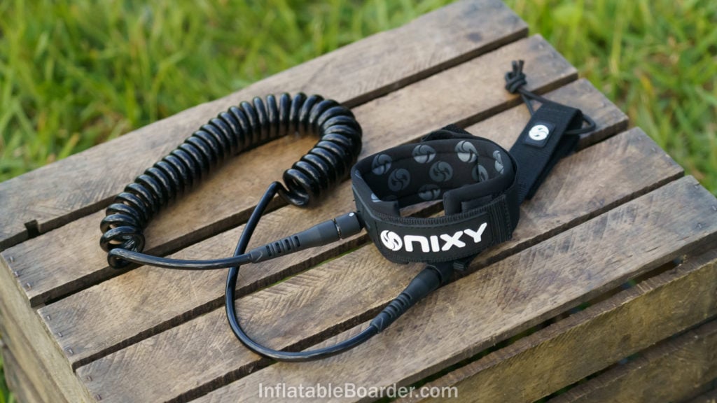 A black coiled NIXY SUP leash.