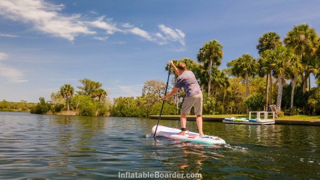 Paddling the All-Around 10' toward shore.