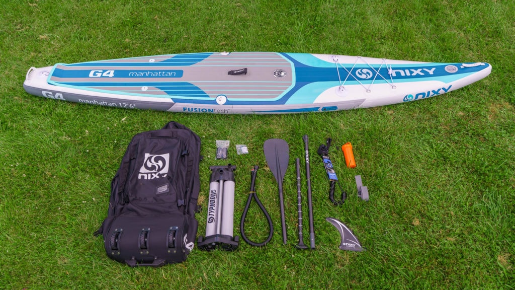Unboxing of the Manhattan accessory package, includes a premium bag, compact dual-chamber pump, carbon-hybrid paddle, SUP leash, single fin, compression strap, and repair kit.