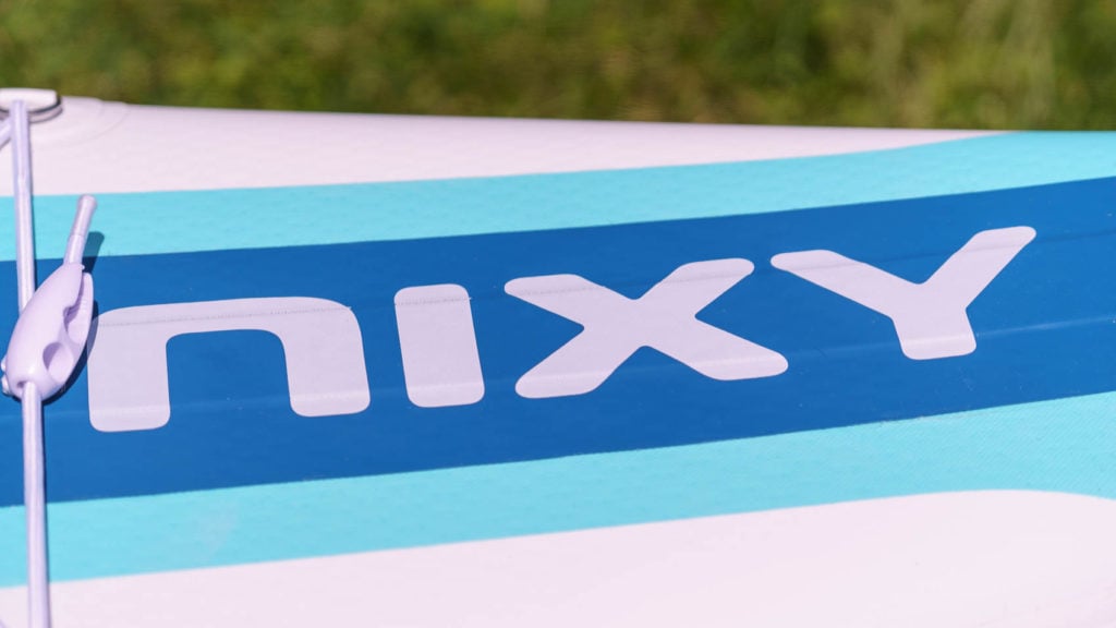 Detail of the front NIXY logo and carbon rail on the top of the board