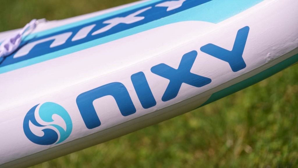 Side rail of the board with the NIXY logo.