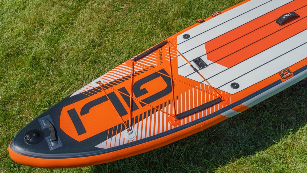 Overview of the front of the orange board's front features, including front action mount, handle, cargo area, and two mid action mounts.