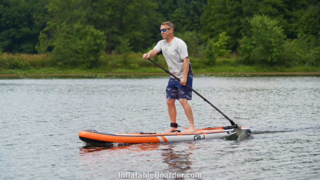 Paddling the SUP hard for speed.