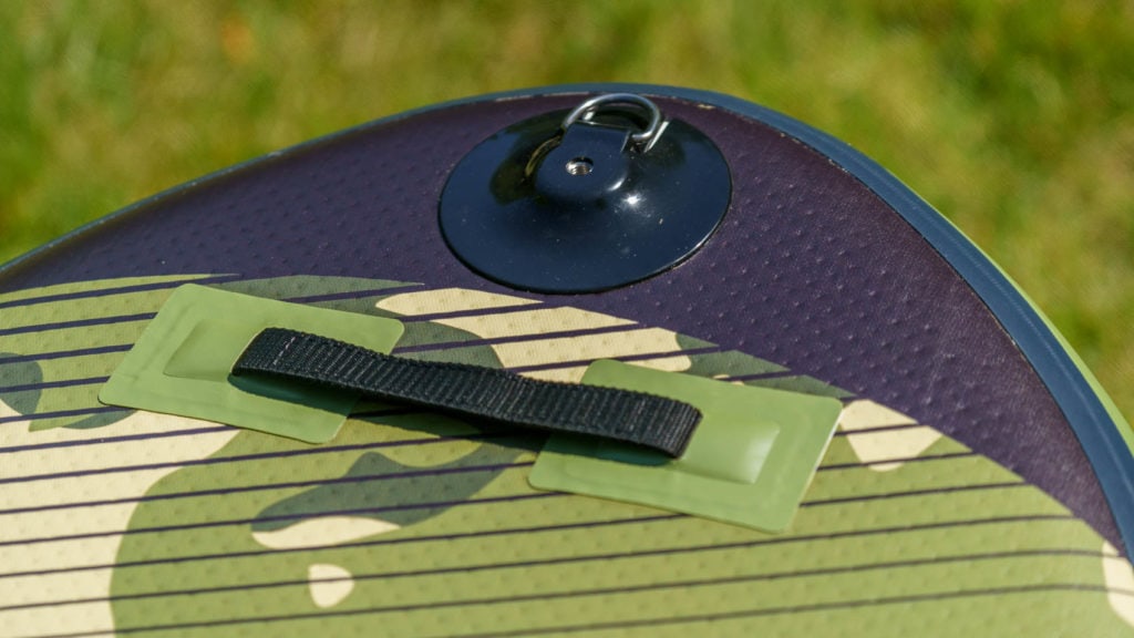 Detail of the nose of the board with unpadded handle and combination accessory mount and d-ring.