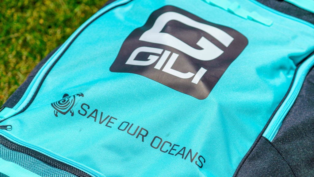 Detail of the GILI and Save Our Ocean logos on the front of the bag.