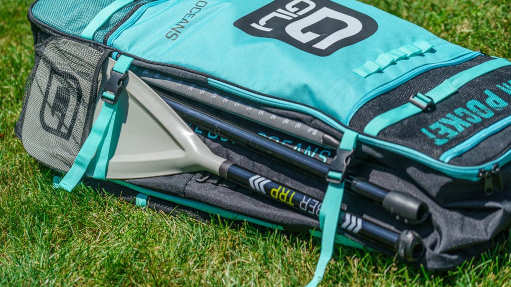 Paddles tucked into the side of the bag.