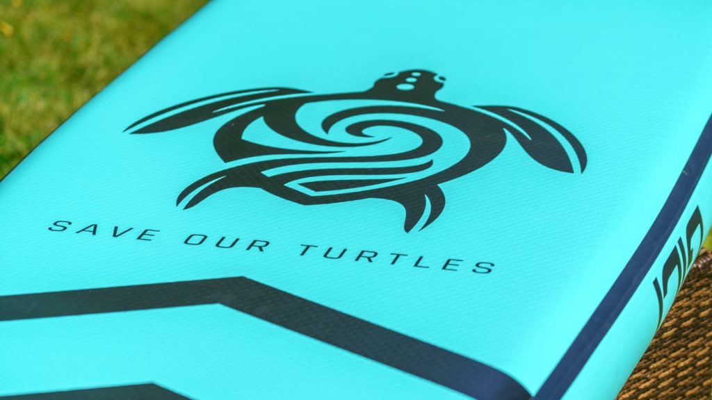 Large Save Our Turtles logo on the back of the board