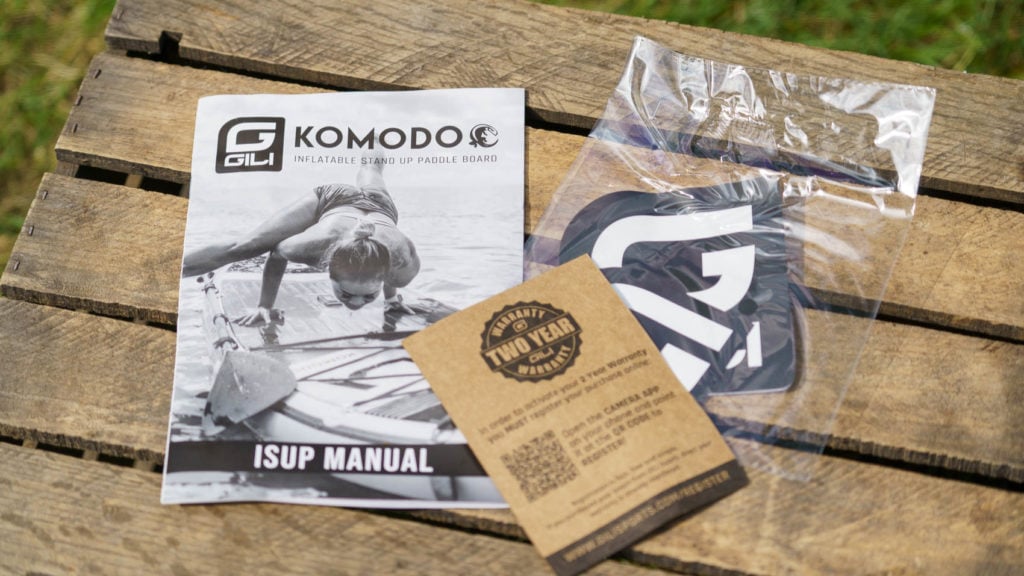 Komodo documentation package includes a manual, warranty card, and sticker pack.