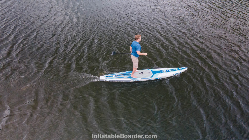 Overhead view of paddling the board on an ocean. The board is only shoulder width.
