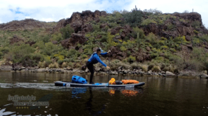 Paddling a SUP loaded with camping gear
