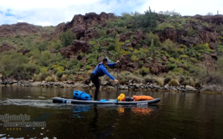 Paddling a SUP loaded with camping gear