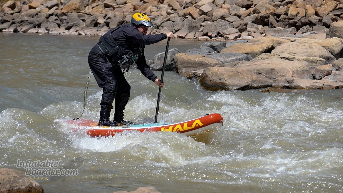 Hala Radito whitewater iSUP review - paddling through a wave