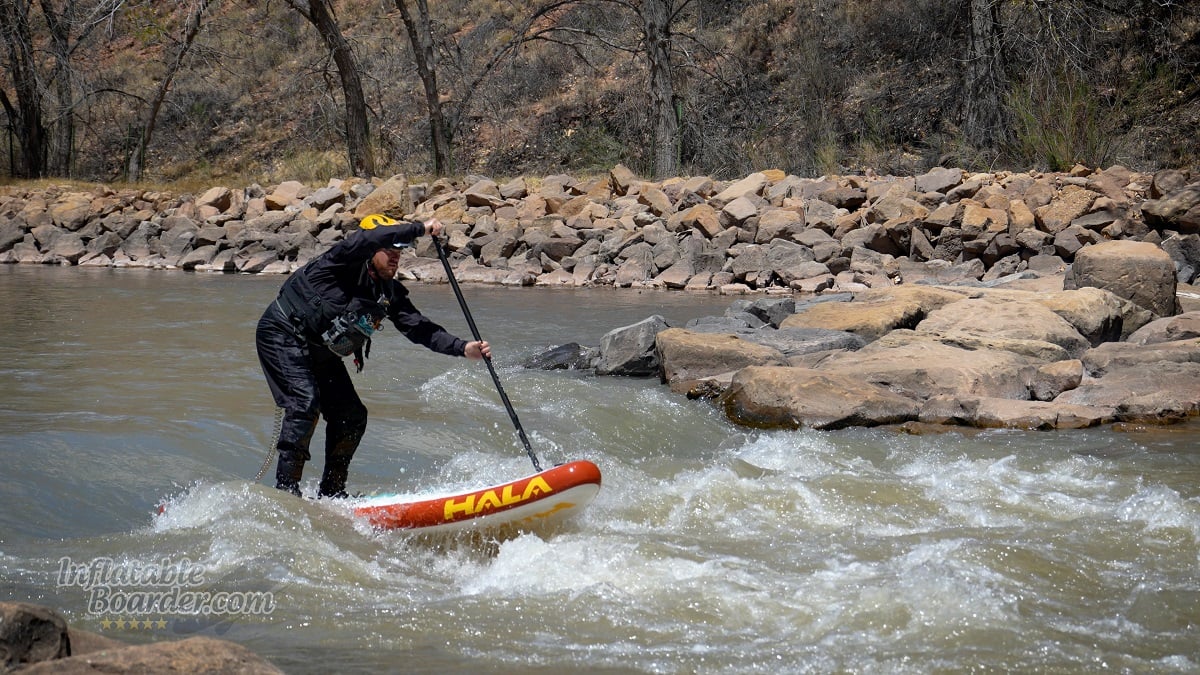 Hala Radito whitewater iSUP review - paddling through a wave